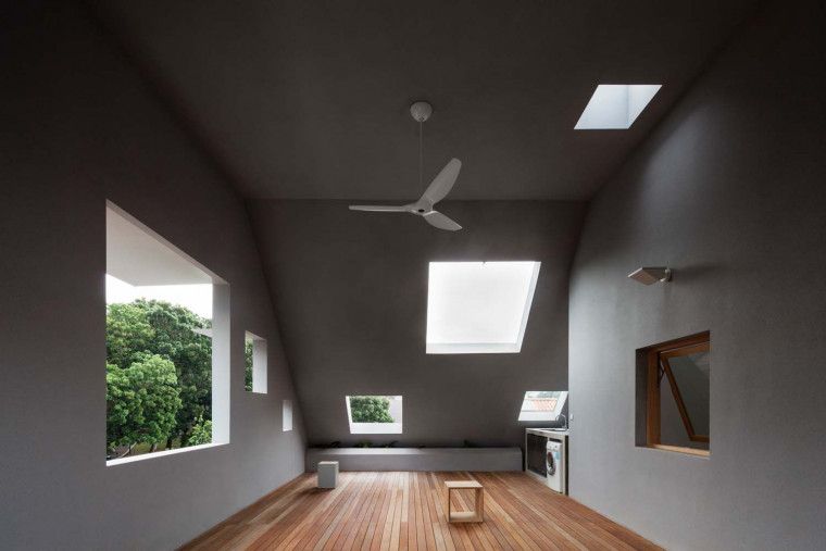 ipli Architects Arranges Square Openings on a House to Control Natural Light and Ventilation