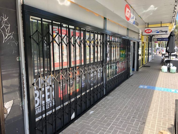 ATDC BRANDED EXPANDABLE SECURITY SHUTTERS FOR IGA STORES