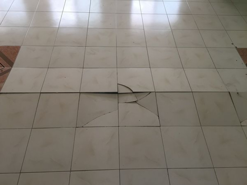 Reasons why tiles buckle